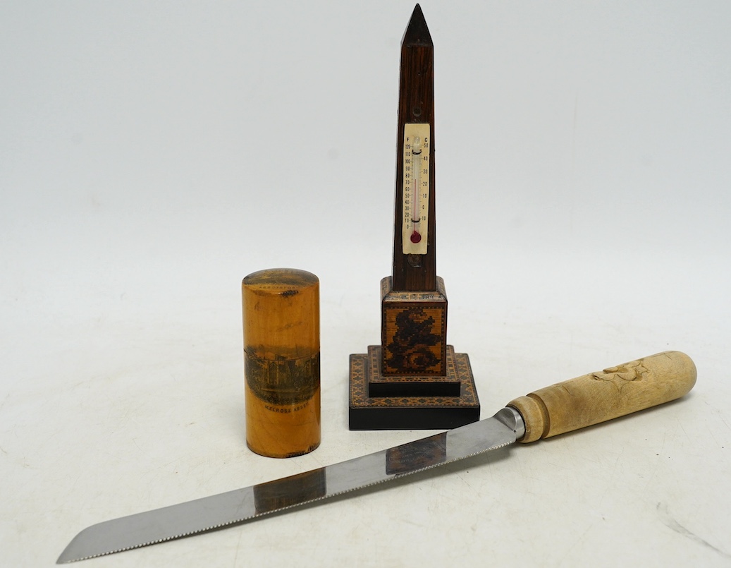 A Tunbridge ware obelisk thermometer, a Mauchline ware box and cover, and a carved bread knife, largest 32cm long. Condition - fair to good